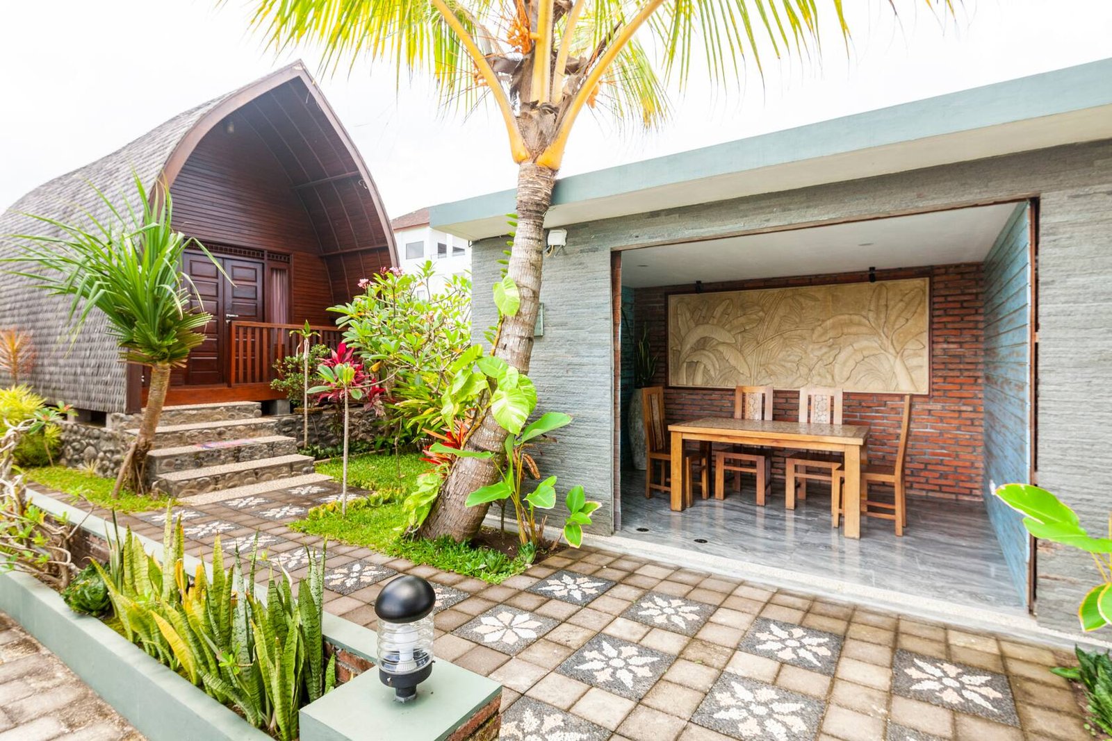 Bungalow and open dining pavilion in the garden